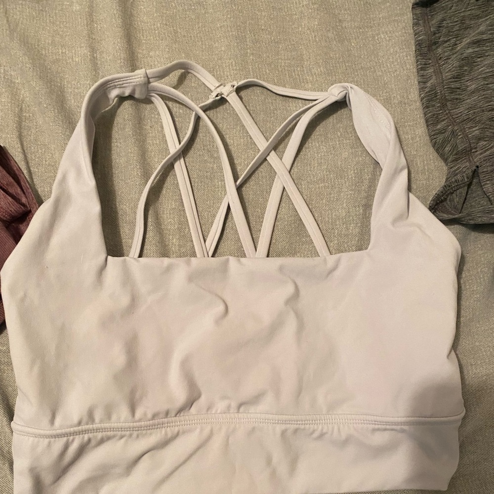 Buffbunny revolution sports bra, barely worn, light gray color.